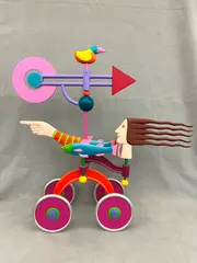 James W. Eaton, "Woman on Wheels with Bird and Fish", Painted mixed media sculpture (aluminum, wood, iron)