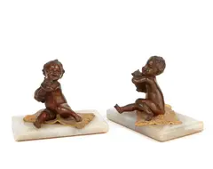 A pair of Putti on carpets (two) by Carl Kauba, sold Oct 2011