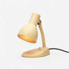 Kandem table lamp by Marianne Brandt, 1928, enameled steel, sold Apr 2022