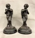 Louis Auguste Moreau, Pair of Bronze Standing Cherubs, Presented on a circular marble base. - Height (including base): 10 inches