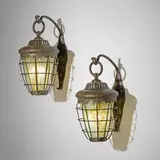Rare turtleback sconces from the John W. Graham residence, pair by Tiffany Studios, c. 1900, patinated bronze, Favrile glass, sold Apr 2025