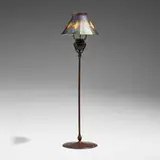 Candlestick with decorated shade by Tiffany Studios, c. 1910, hand-blown Favrile glass, patinated bronze, sold Apr 2025