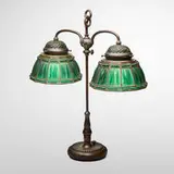 Linenfold double student lamp by Tiffany Studios, 1899-1920, patinated bronze, leaded frosted glass, sold Apr 2025