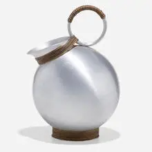 Rare Sherry pitcher by Russel Wright, c. 1935, spun aluminum, rattan, sold Feb 2022