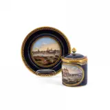 Deckeltasse mit Ansicht von Meissen und Untertasse mit Ansicht von Dresden by Meissen, Porzellan, kobaltblauer Fond, farbig staffiert, gold dekoriert, sold Jan 2025