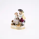 Kleine Kindergruppe mit Hund by Meissen, Wohl 19.Jh, Porzellan, farbig und gold staffiert, sold May 2025