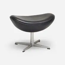 Arne Jacobsen, Egg ottoman, 1958, leather, cast aluminum, plastic