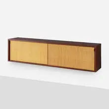 Cabinet by Florence Knoll, c. 1960, walnut, grass cloth, leather, sold Sep 2021