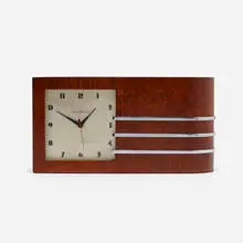 World's Fair table clock, model 4082 by Gilbert Rohde, c. 1933, Maidou burl, chrome-plated steel, enameled aluminum, glass, sold Sep 2021