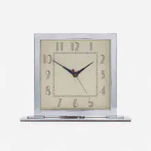 Gilbert Rohde, Table clock, c. 1935, chrome-plated aluminum and steel, glass, enameled aluminum
