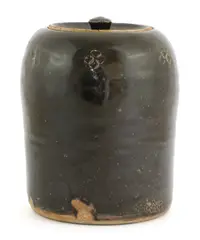 William Marshall (1923-2007) by William Marshall, a tenmoku-glazed lidded stoneware urn, sold Oct 2021