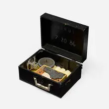 Jacques Flèchemuller, Bomb (Bierut), 1986, painted fabric-covered case, wax, non-functioning electronic components