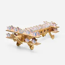 Pedro Friedeberg, Aeroplane, c. 1985, found object assemblage with printed paper, gilt wood