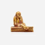 Production paperweight with monkey and book by Kataro Shirayamadani for Rookwood Pottery, 1927, glazed porcelain, sold Nov 2022