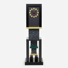 Metropole clock by George Sowden, 1982, laminate over wood, Plexiglas, lacquered wood, enameled aluminum, enameled brass, sold Apr 2021