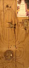 Mr. Bradley / Mr. Martin by William S. Burroughs, 1982, photo with gunshot holes on plywood, sold Nov 2008