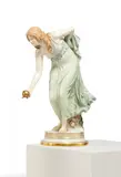 Figur der "Kugelspielerin" by Meissen, Porzellan, farbig staffiert, sold May 2025