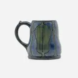 Early mug with magnolia seed pods and leaves by Sara Bloom Levy for Newcomb College Pottery, sold Nov 2022