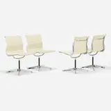 Charles and Ray Eames, Aluminum Group chairs, set of four, polished aluminum, enameled steel, leather