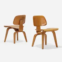 Charles and Ray Eames, DCWs, pair, 1945, molded mahogany plywood, rubber