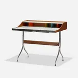 Swag Leg desk by George Nelson & Associates, 1954, walnut, chrome-plated steel, laminate, lacquered wood, sold Feb 2021