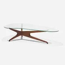 Coffee table by Vladimir Kagan, c. 1955, walnut, glass, sold Feb 2021