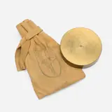 Martin Kippenberger, Broken Centimeter, 1991-92, gold colored metal disc in blue printed suede bag