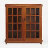 Double-door bookcase, model 645 by L. & J.G. Stickley, c. 1910, oak, hammered copper, patinated iron, glass, sold Oct 2022