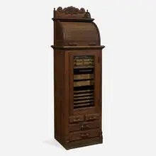 The Harvard Co., Tall dentist's cabinet, c. 1900, oak, beveled glass, brass, iron, copper
