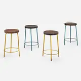 Stools from the College of Architecture, Chandigarh, set of four by Pierre Jeanneret, c. 1960, enameled steel, teak, sold Jun 2022