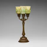 Tiffany Studios, Three-light table lamp, c. 1910, patinated bronze, hand-blown Favrile glass
