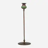 Blown-out candlestick by Tiffany Studios, c. 1910, patinated bronze, hand-blown glass, sold Oct 2024