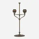 Adjustable two-light candlestick by Tiffany Studios, c. 1910, patinated bronze, sold Oct 2024