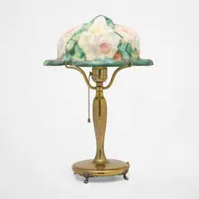 Puffy boudoir lamp with roses by Pairpoint, c. 1915, reverse-painted frosted glass, brass, sold Oct 2024