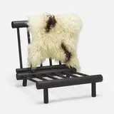 attribution Charlotte Perriand, lounge chair, c. 1968, ebonized elm, sheepskin