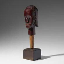 Byeri reliquary head by Fang, carved and lacquered wood, enameled steel, sold Nov 2020