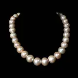 A Pearl Choker Necklace, Untitled, The necklace features graduating size pearls from 13mm to 15mm held by a copper lock. <br> The necklace length is 16 inches. <br> Weighs 110.0 grams
