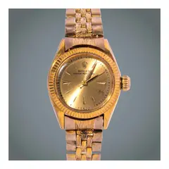 Rolex, A Lady’s 14K gold Automatic Water - Resistant Wristwatch