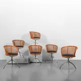 Paolo Rizzatto, A lot of six 'Young Lady armchairs, 1991, Die-cast aluminum structures, beech and rattan seats, cushions covered in Alcantara