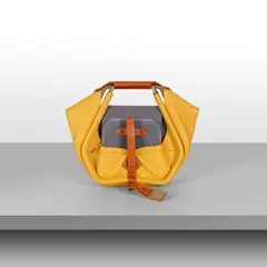 A bag transformable into a stool 'Stool', from the 'Objet Nomades' line by Patricia Urquiola, 2015, Metal frame, leather, 3D woven lining, gold-plated details, offered Apr 2026
