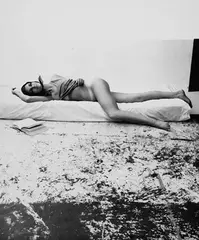 Sam Haskins, November girl reading in bed, 1966, photograph