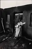 Ian Berry, A house burnt down during a political raid, Maseru, Lesotho 1961, 1961, photograph