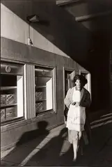 Peter Marlow, Woman on her way to work, Liverpool, Great Britain 1987, 1987, photograph