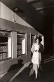 Peter Marlow, Woman on her way to work, Liverpool, Great Britain 1987, 1987, photograph