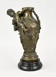H 32 cm. by Gesigneerde bronzen vaas met putti en marmeren basement, Gesigneerde bronzen vaas met putti en marmeren basement, offered Oct 2023