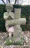Biddende jongen bij kruis by Antiek zandstenen beeld van biddende jongen bij kruis, offered Apr 2025