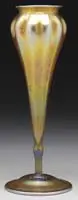 Flower Form Vase by Tiffany Studios, Deeply ribbed favrile glass vase rests atop an inverted saucer foot, offered Jun 2012