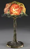 Pairpoint, Puffy Rose Bonnet Boudoir Lamp, Shade rests on a Pairpoint treetrunk boudoir base with brass finish