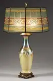 Quezal, Art Glass Lamp, The glass rests in a cast metal foot and supports a two socket cluster