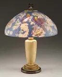 Handel, Reverse Painted Parrot Lamp, Shade rests atop a simple enameled base with three-light cluster